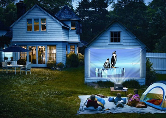 Set up a projector in the garden for a backyard cinema